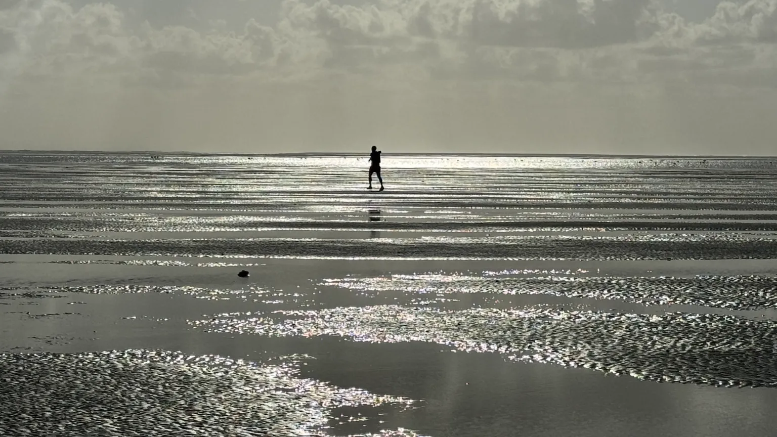 Azulik Man running along the beach