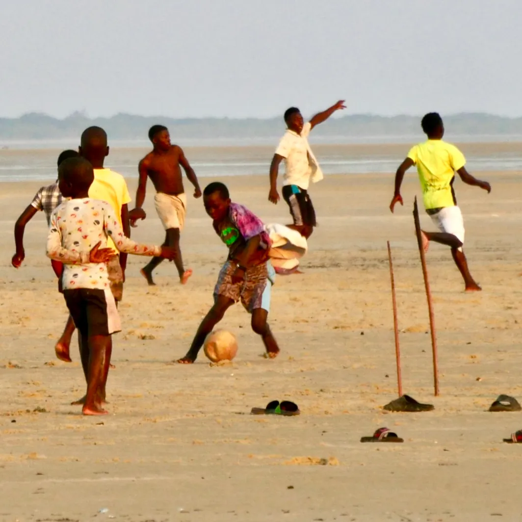 Azulik kids playing football on the beach
